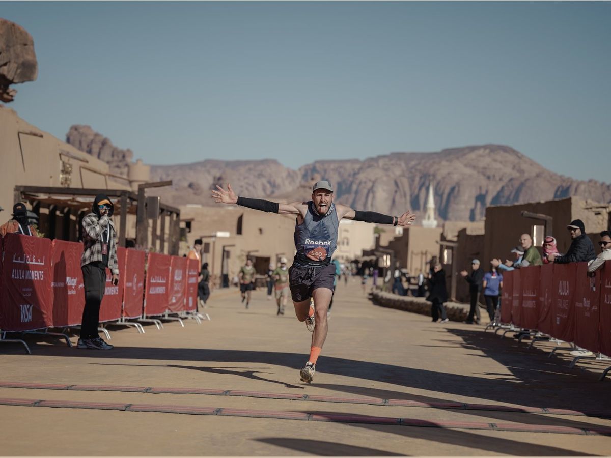 Fuad Abu Safi crossing the finish line at the AlUla Ultra Trail in Saudi Arabia