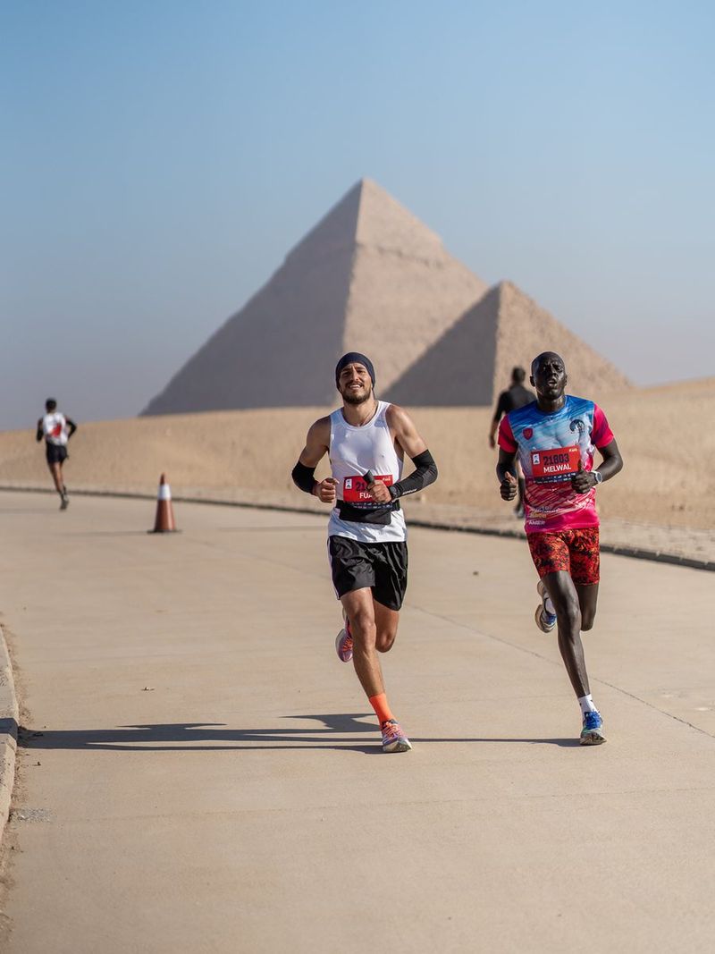 Fuad Abu Safi running past the Pyramids of Giza during the Marakez Pyramids Half Marathon